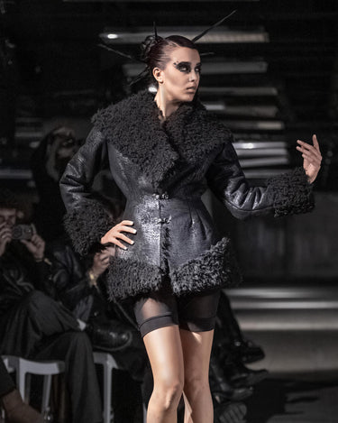 STRUCTURED FAUX FUR JACKET - Fitted jacket with sculptural volume and textured contrast