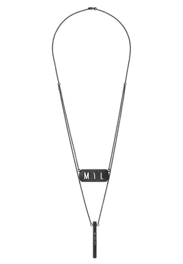 Flat lay of Beacon layered necklace in black stainless steel, anchor chain with MYL tag and engraved pendant by MYL BERLIN.