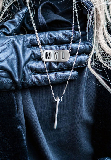 Unisex silver layered necklace with dual stainless steel chains, engraved message pendant, and MYL tag - streetwear-style jewelry by MYL BERLIN