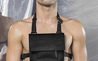 Model wearing the MYL BERLIN harness body belt bag in black saddle leather