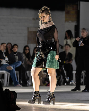 SYNAPSE Fur Shorts High-shine patent shorts with faux fur side panels