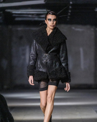 STRUCTURED FAUX FUR JACKET - Fitted jacket with sculptural volume and textured contrast